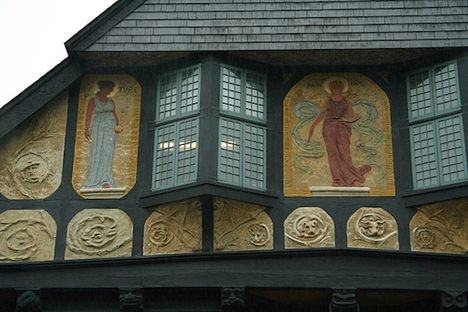 Detail of the exterior hand-carved art. (via City Profile)