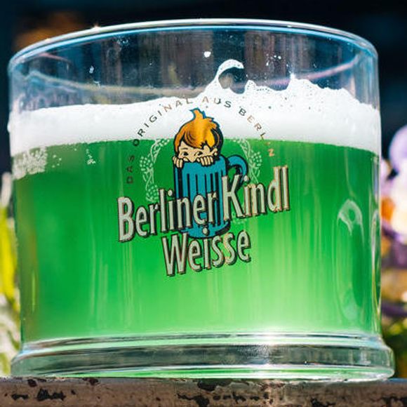 Berliner weisse, flavored with green woodruff syrup. (Yes, that's a child in a mug on the brewery's logo.)