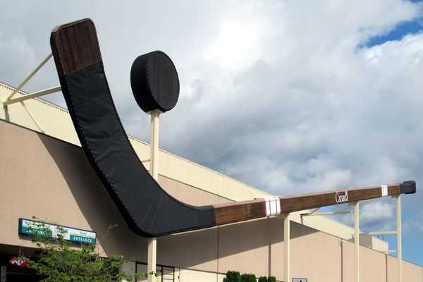 The World's Largest Hockey Stick & Puck hang on the side of the rink where the Cowichan Capitals Junior A Hockey Club plays in Duncan, British Columbia, Canada.