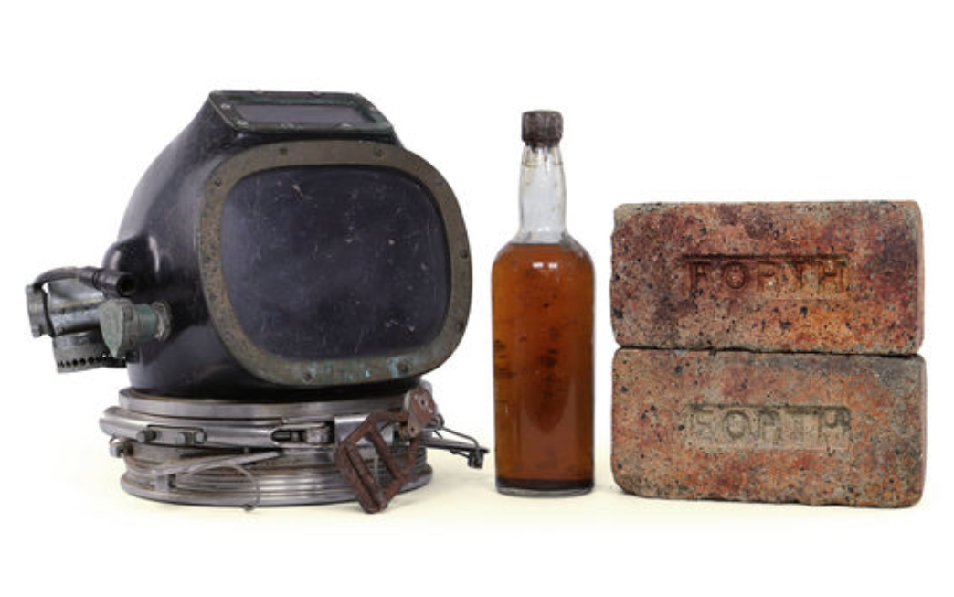 The full auction lot includes original bricks from the ship and a diving helmet.