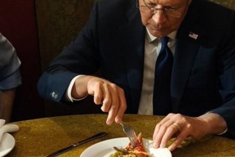 The Politics Behind Presidential Candidates Eating Pizza With a Fork
