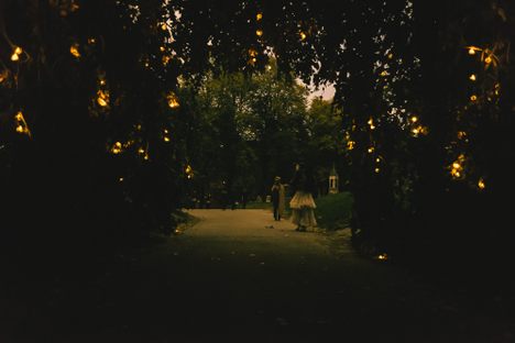 Under a weeping beech tree strung with lights, Ryder and Hazel perform on a Tibetan singing bowl.