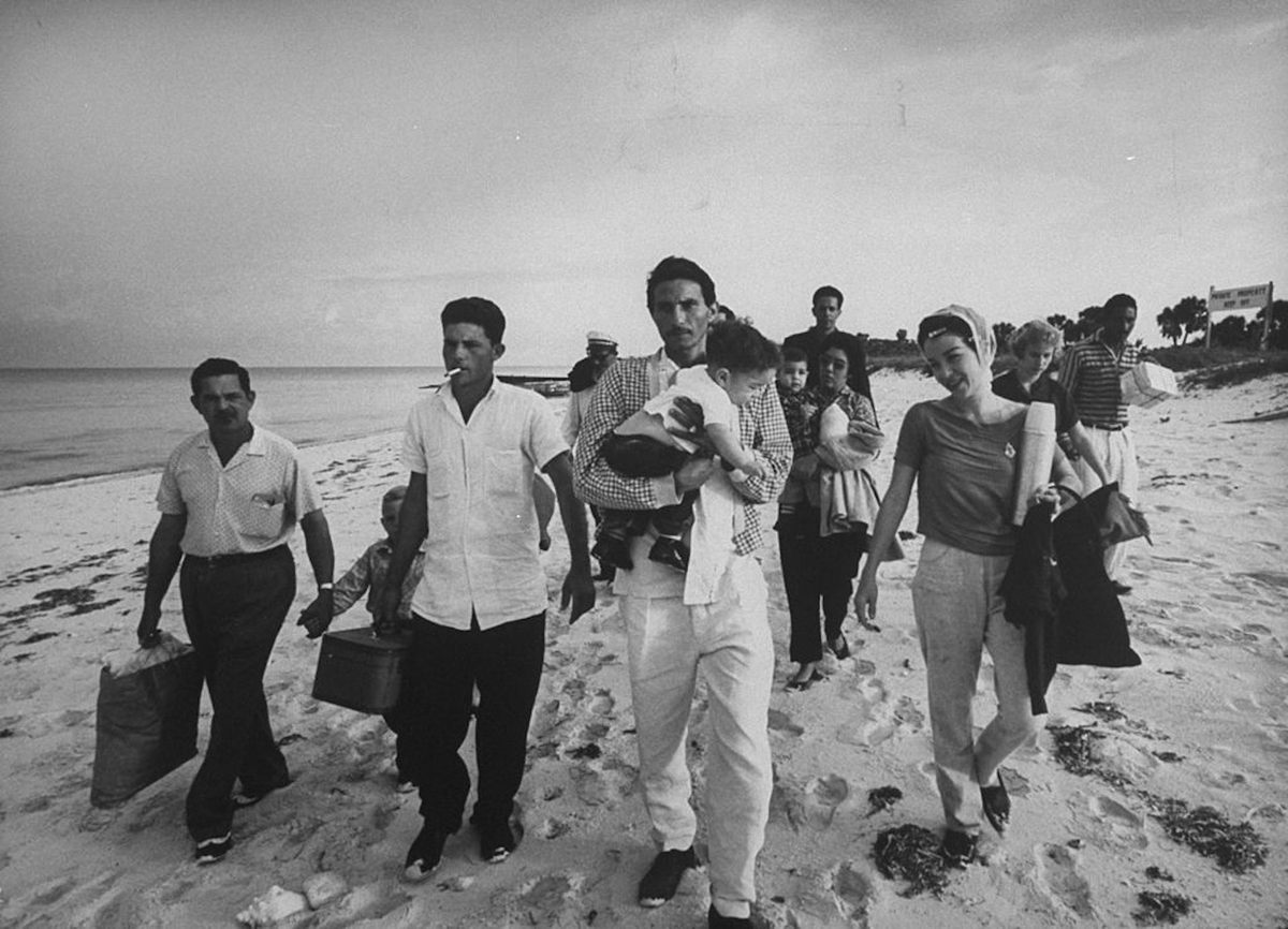 Cuban refugees on the island of Cay Sal wait for the U.S. Coast Guard to take them to Florida in 1962.
