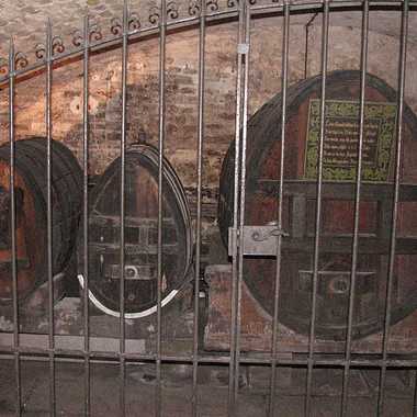On the right, this barrel is supposed to be filled with the oldest alcohol still stored in the world, a white wine from the year 1472.