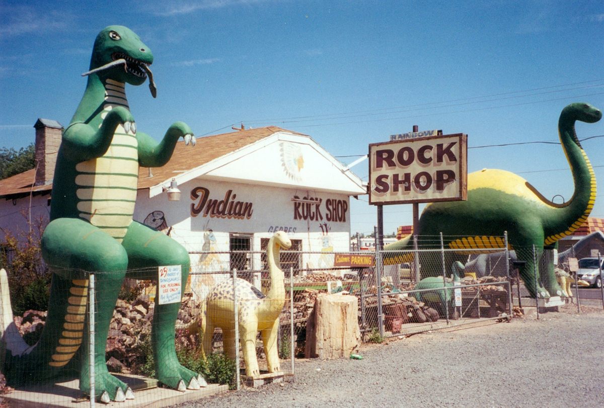 The Rainbow Rock Shop, complete with roadside dinosaurs, in Holbrook Arizona.