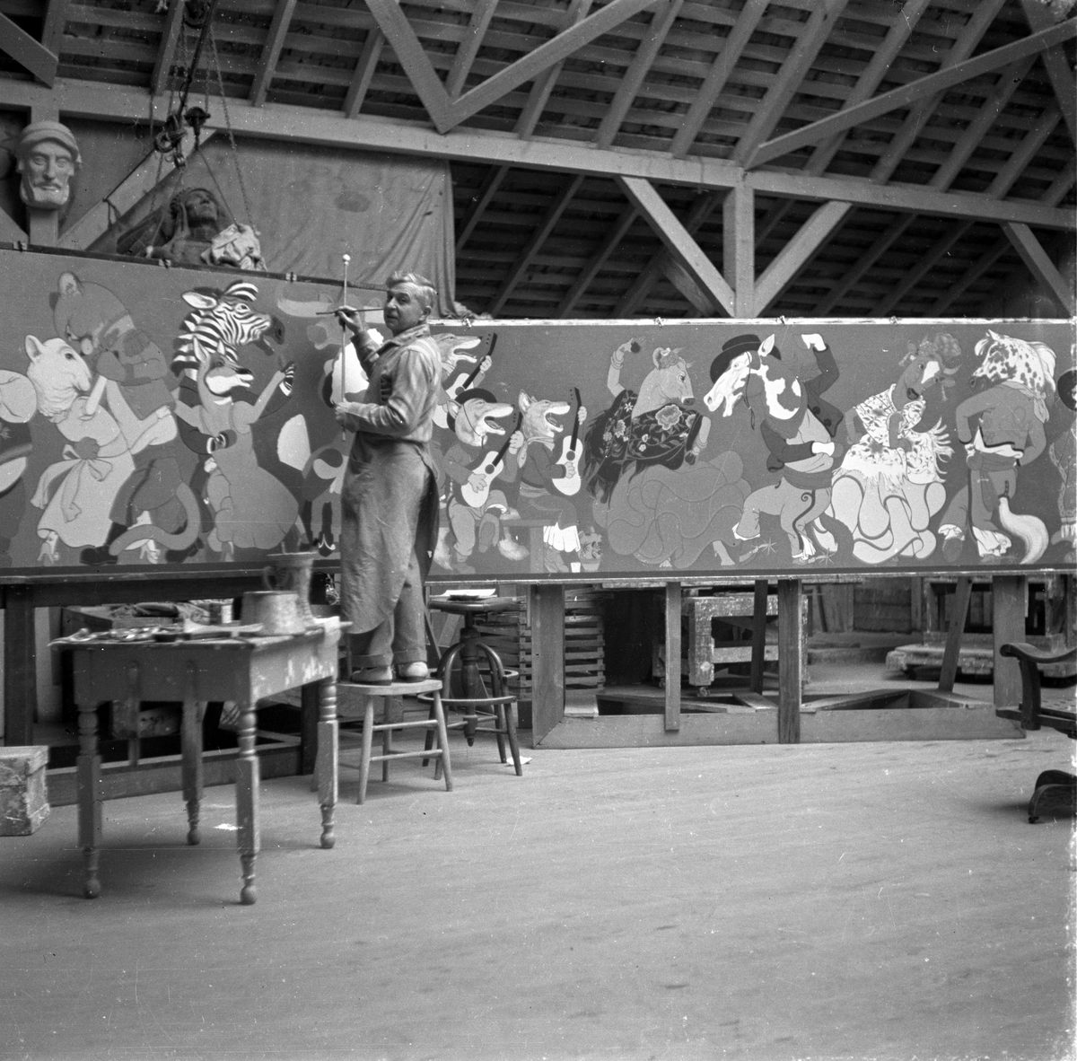 Mora at work on one of his Fable Restaurant murals, created for the Drake-Wiltshire Hotel in San Francisco in 1936.