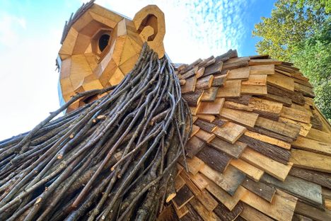 Benny is one of 100 wooden trolls crafted from reclaimed lumber.