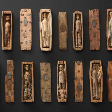 A collection of 8 coffins with their lids and carved figures, found in a rocky niche on the north-eastern slopes of Arthur's Seat, Edinburgh, in June 1836