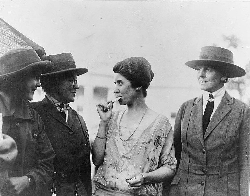 First Lady Grace Coolidge, eating a Girl Scout cookie in 1923.