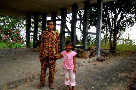 A young girl charging $1 apiece entrance fee