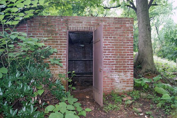 The heavy iron door is unlocked.