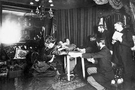 Medium Eusapia Palladino performs a séance at the French home of astronomer Camille Flammarion on November 24, 1898.