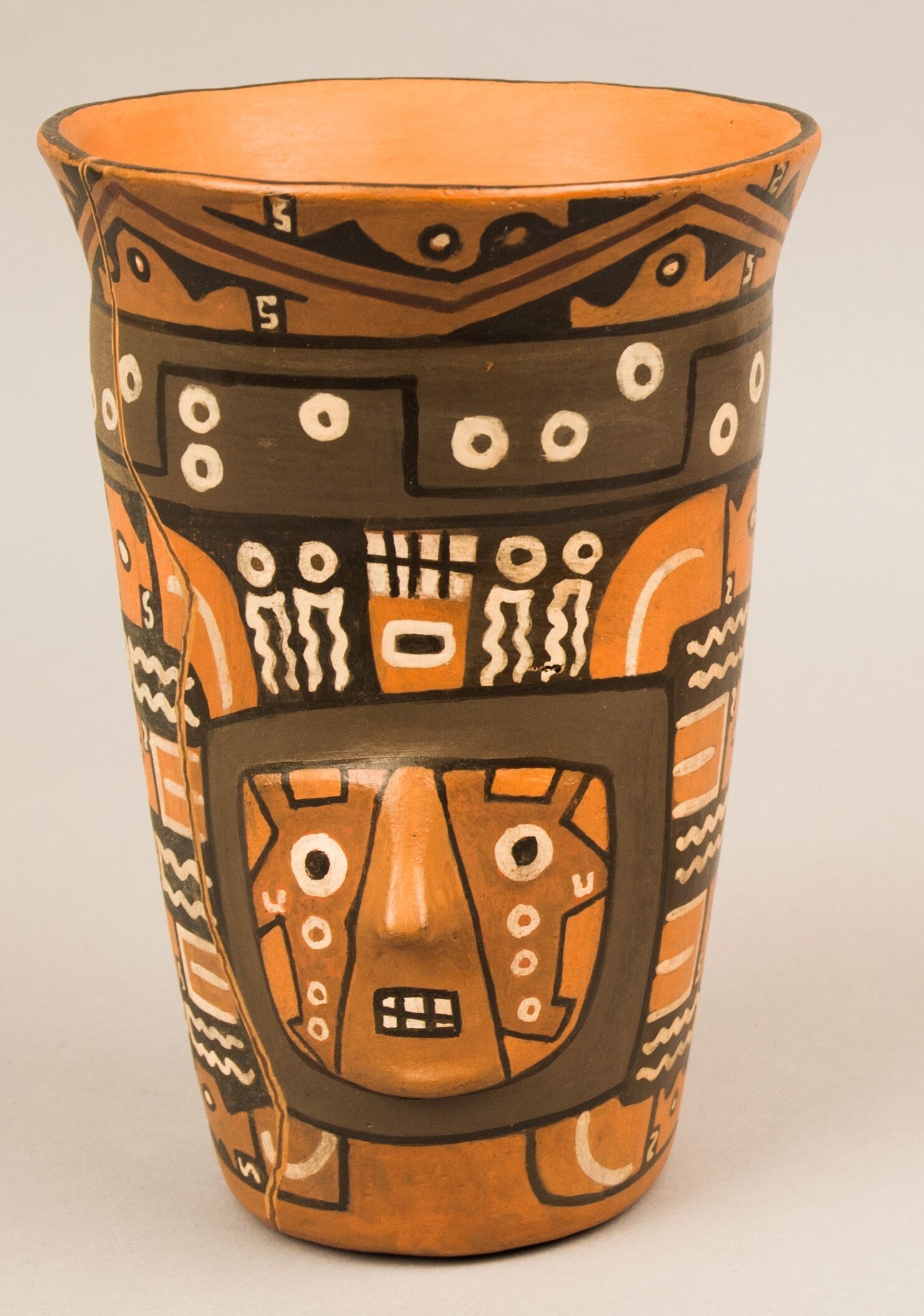 An ornately decorated vessel for chicha.