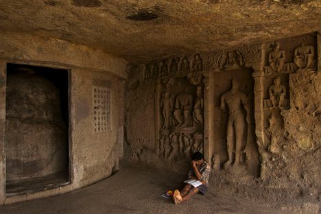 Boy studying at Mahakali Caves.