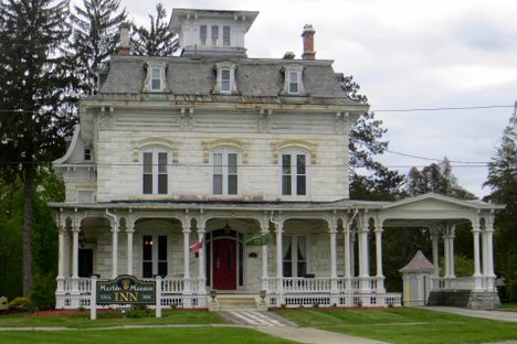 The Allen House is the larger of the two, built in 1867.