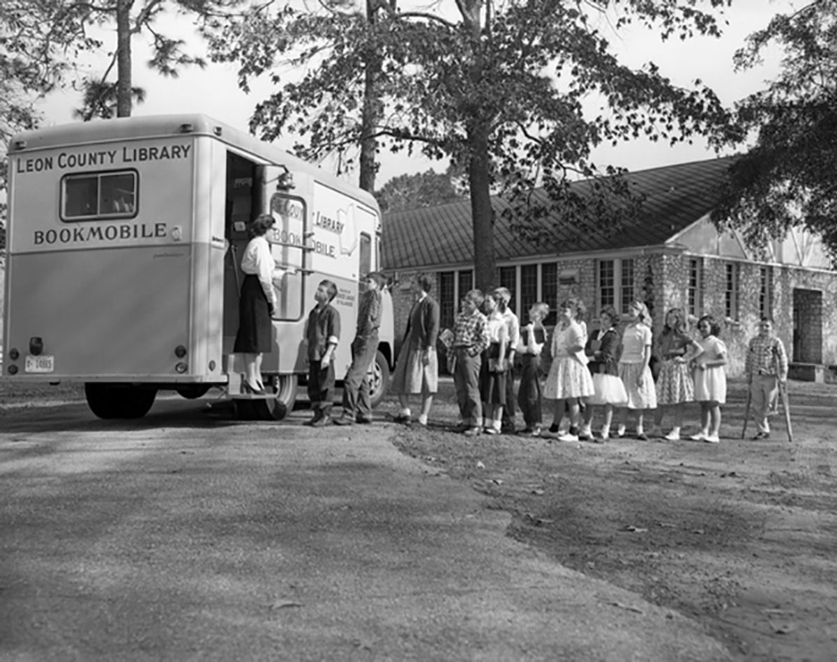 Students lining up at the Leon County Public Library bookmobile, Woodville Elementary School, Florida, 1957.