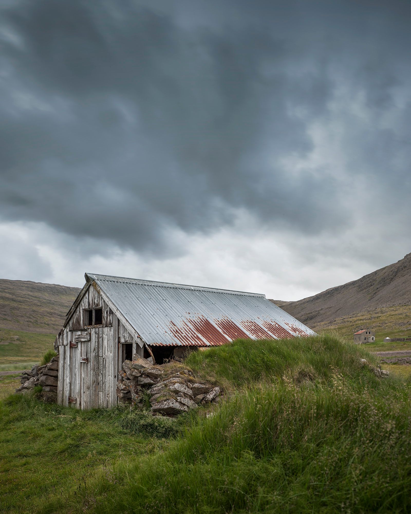 The overgrown remains of an abandoned fishing shack.