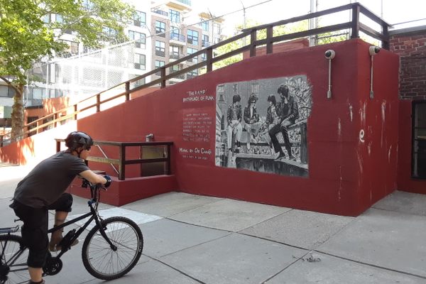 A visitor admires the mural on the ramp where punk was born.