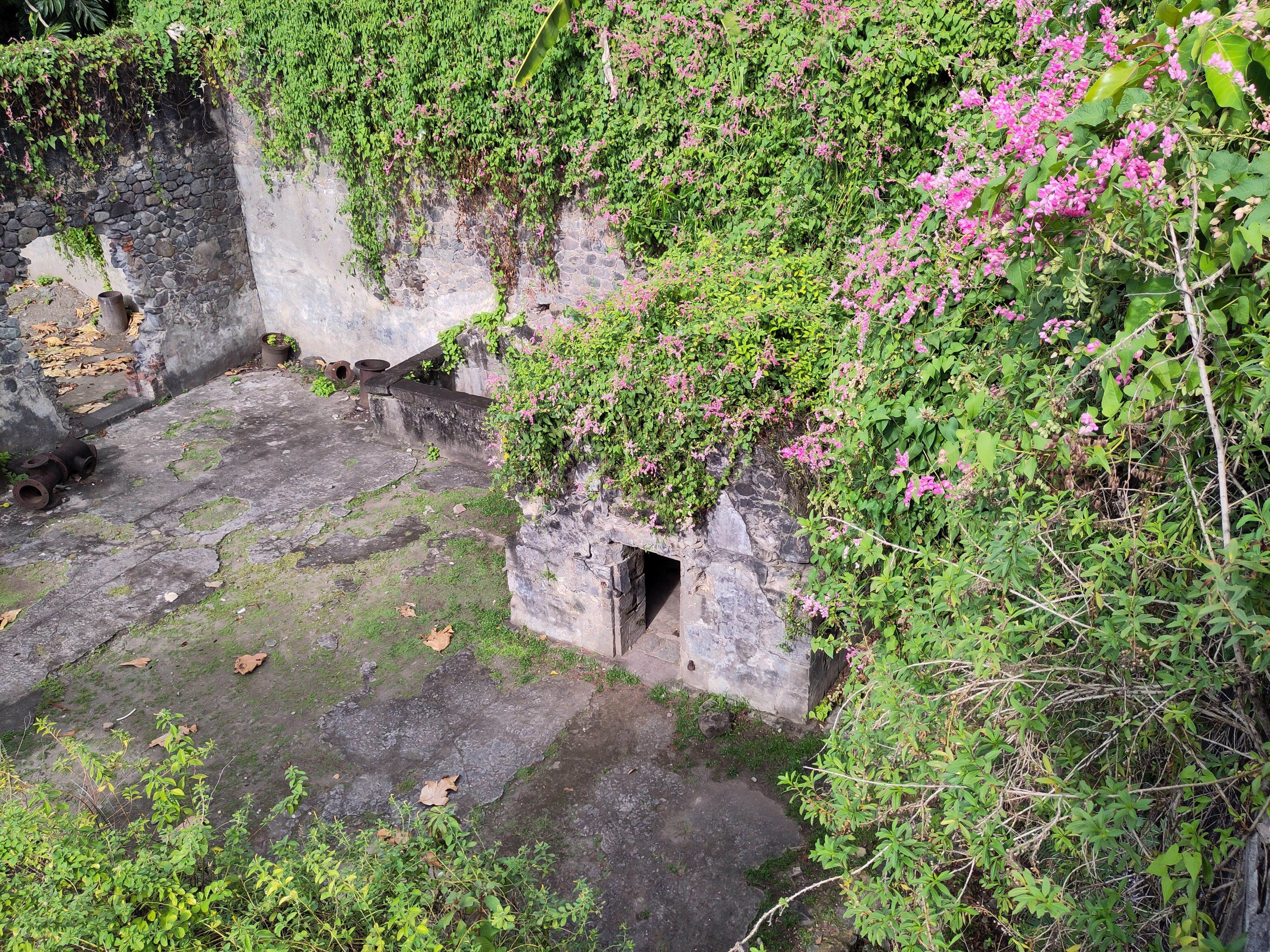 Prison cell viewed from the ruins of the theatre above.