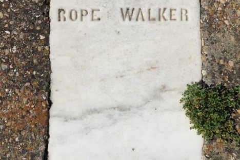 His original headstone, set in cement.