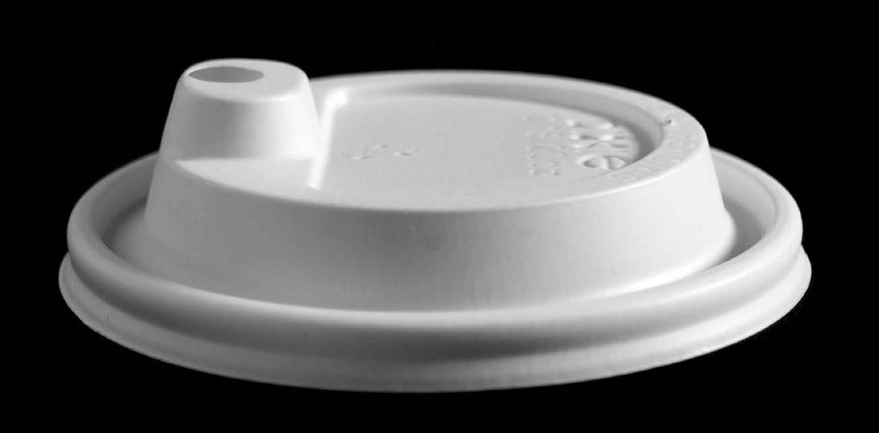 A lid with a sippy cup-style aperture. 