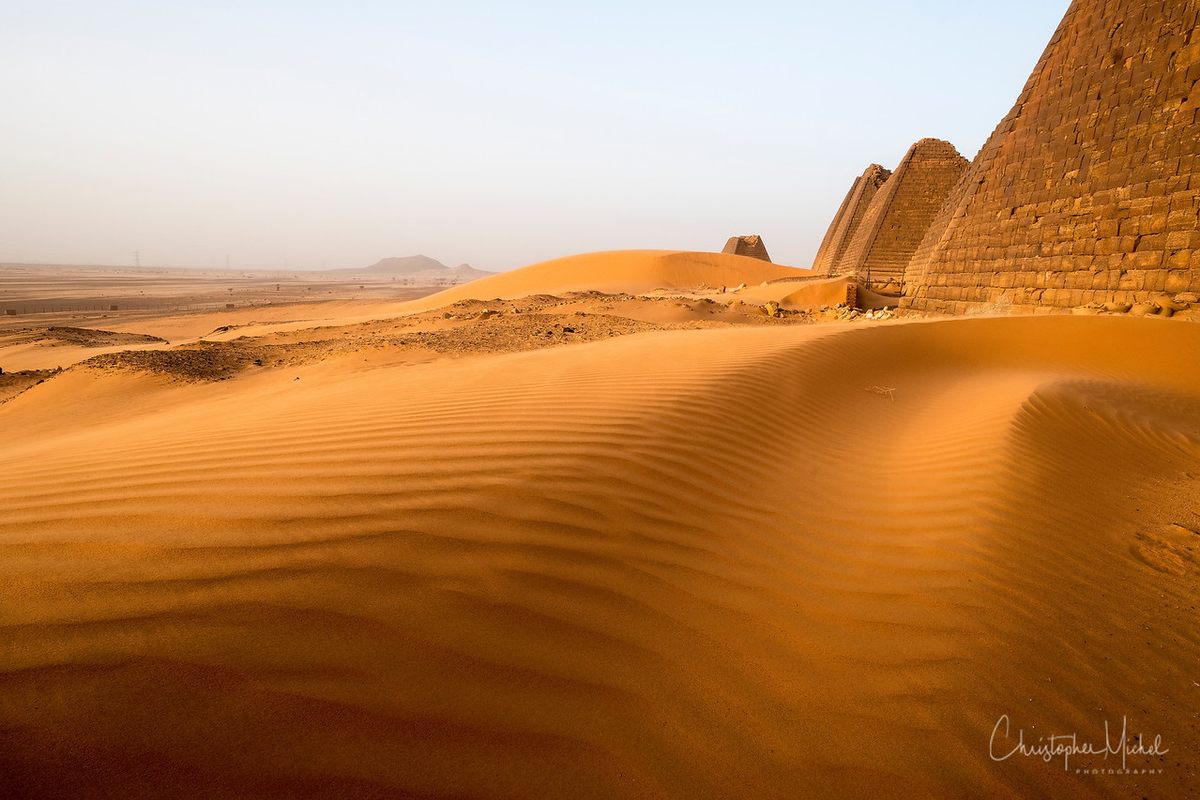 Sand dunes consistently threaten to cover the pyramids.