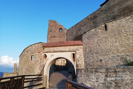 The gate, with a modern wooden walkway.