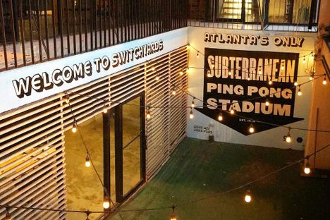 View of the Ping Pong club from the street at night.