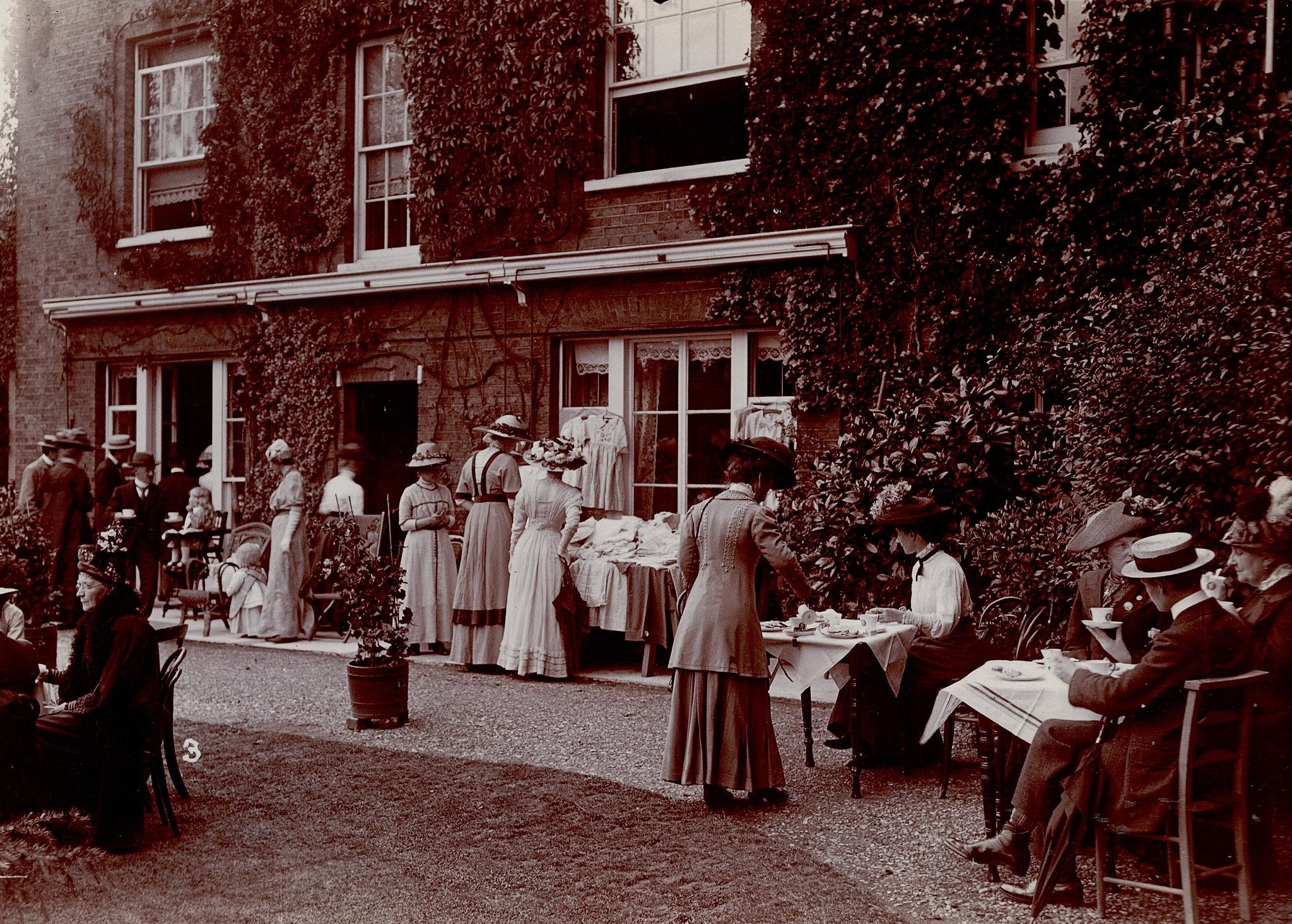 A garden party using "suffragette china."