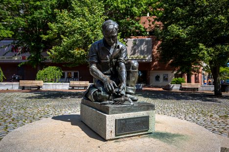 The Maine Lobsterman statue stands in the heart of Portland, in a plaza near the city's Old Port.