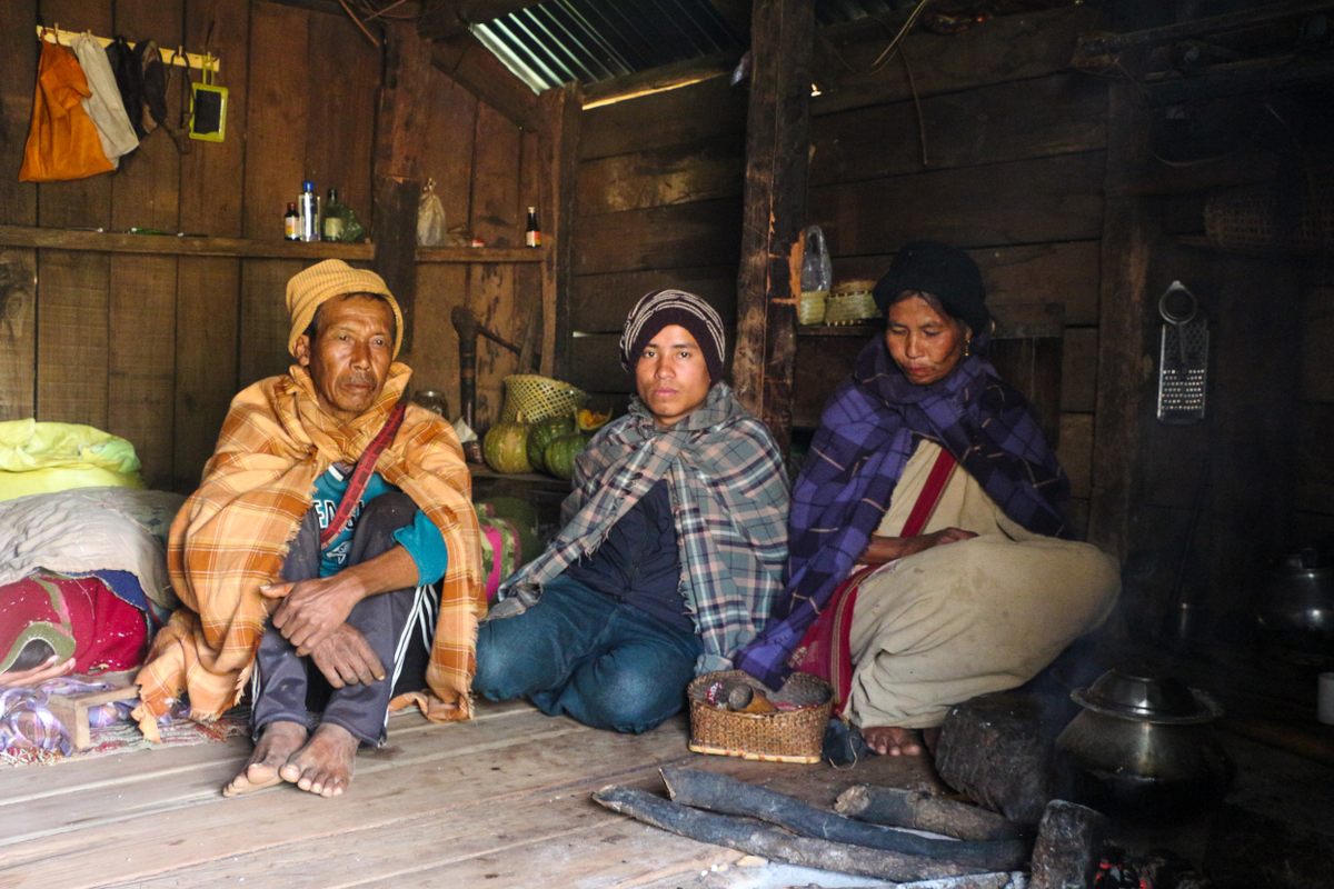 Rice cooks on a wood fire in the household of Shidiap Khongsti (right). Barailang sits in the center.