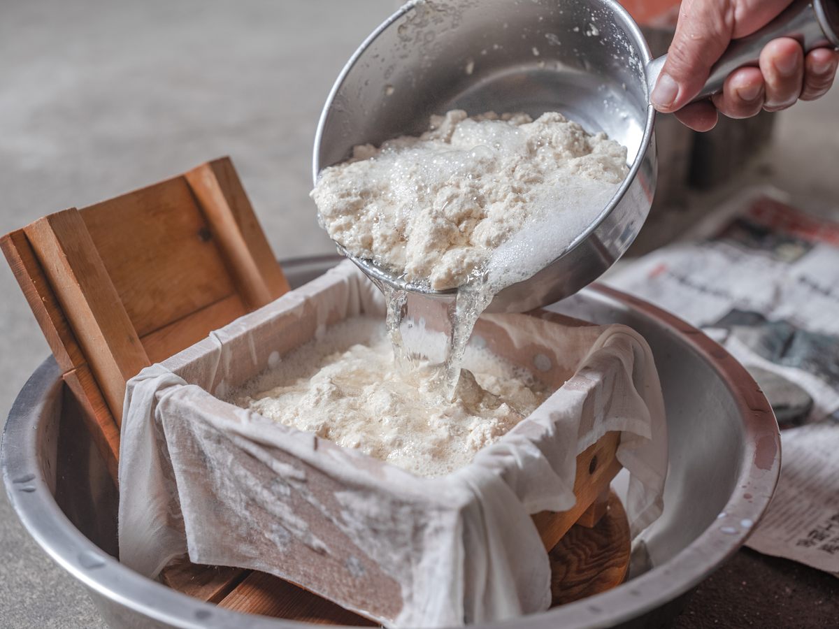 The volcanic water is filtered through the tofu mould.