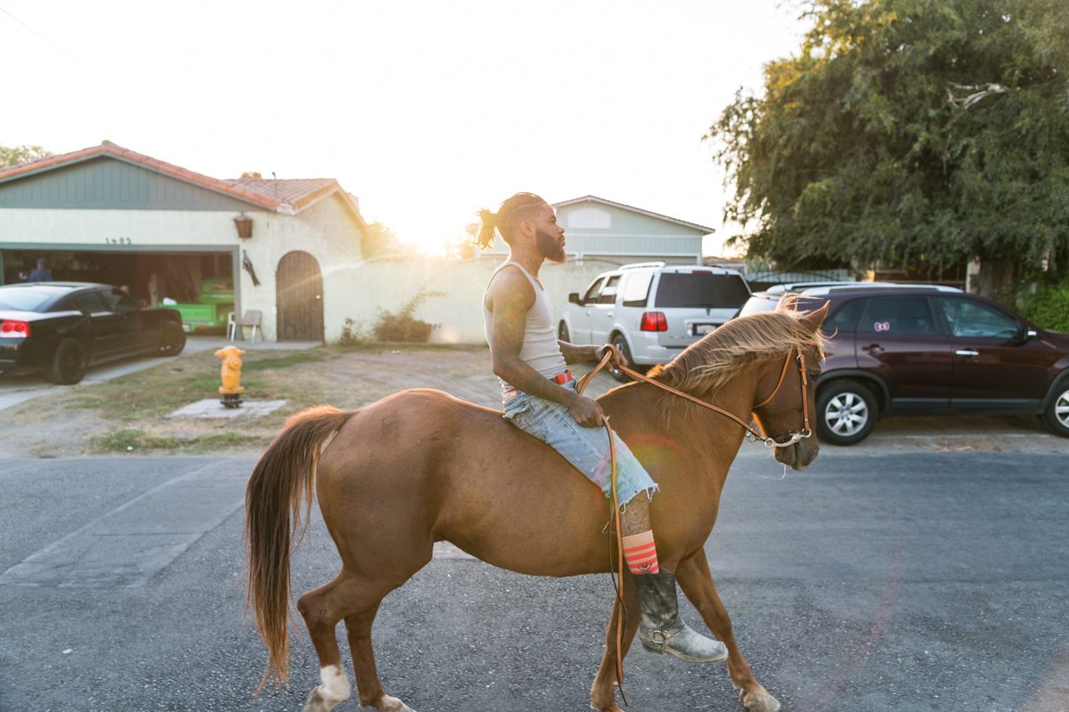 Keenan Abercrombia rides through the streets of Compton.
