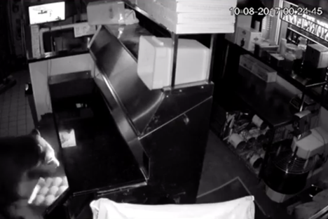 A cub pulls some dough balls out of the fridge.