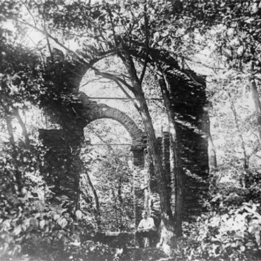 An unidentified man sitting in front of the Cruger Island "ruins", probably in the early decades of the 20th century
