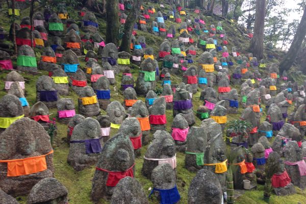 Parents of deceased children place colorful “bibs” on Jizo statues to show their gratitude for his protection in the afterlife.