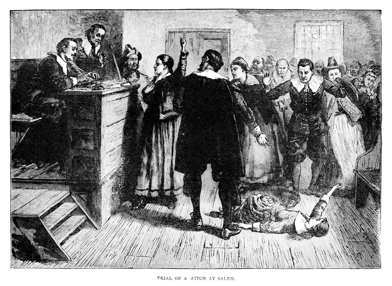 An illustration of a court scene during the late-17th century Salem witch trials. 