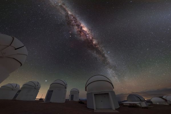 The center of the Milky Way glows in various colors, an effect invisible to the naked eye, in this time-exposure photo from the Cerro Tololo Inter-American Observatory (CTIO) in Northern Chile.
