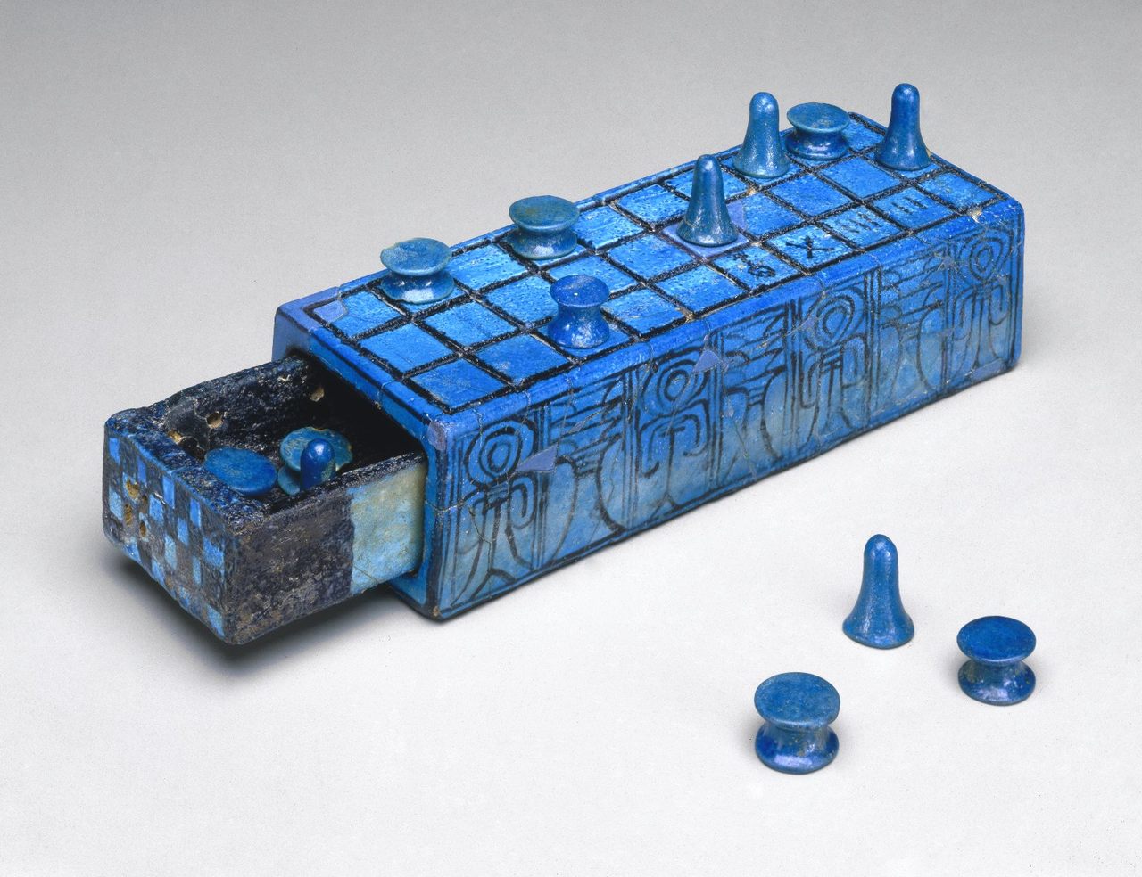 An ancient senet board inscribed with the name of Amenhotep III, with a sliding compartment for pieces, dating to the 14th century B.C. 