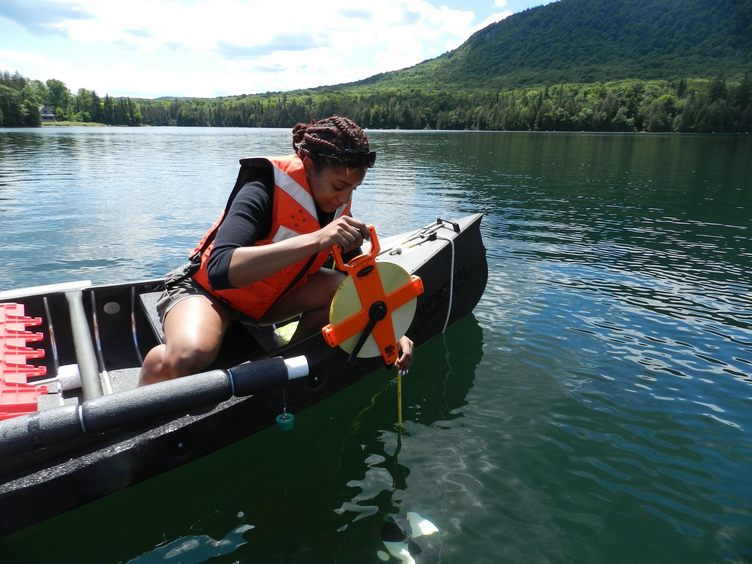 A National Lakes Assessment volunteer tests the transparency of a lake in 2012.