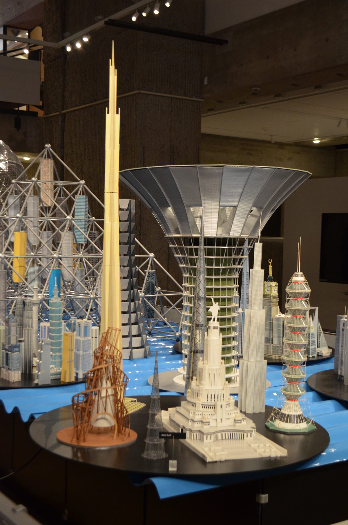 Frank Lloyd Wright's "Mile High," also called "The Illinois," towers over the other models, including the trumpet-shaped "Green Float," a floating, carbon-neutral city.