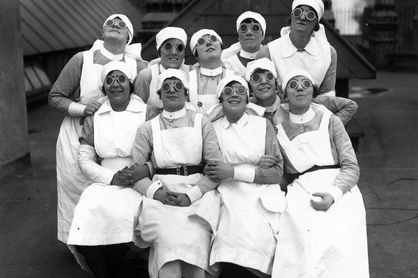 A group of nurses observing a solar eclipse, England, 1927.