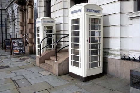 Cream phone booths.