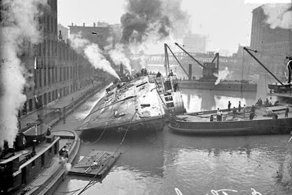 The S.S. Eastland being hauled upright.
