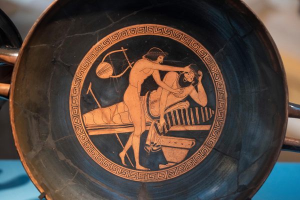 The Ancient Greeks often decorated pottery used during parties with scenes from those events, like this symopsium (drinking party) attendee getting sick from too much wine.