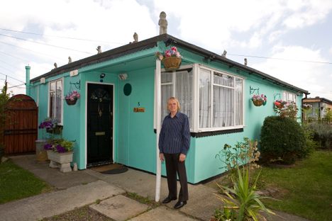 Jim Blackender in front of his prefab, 2009.