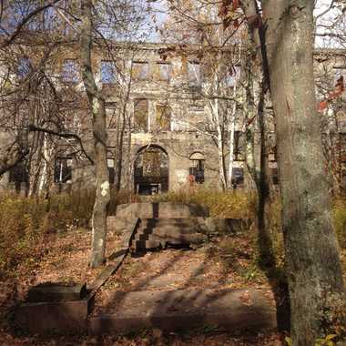 The Overlook Mountain House looming out of the forest.