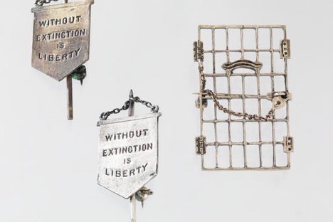 Alice Paul's "Jailed for Freedom" and "Silent Sentinel" pins. 