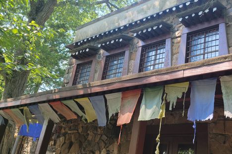 Prayer flags on the front of the chanting hall.