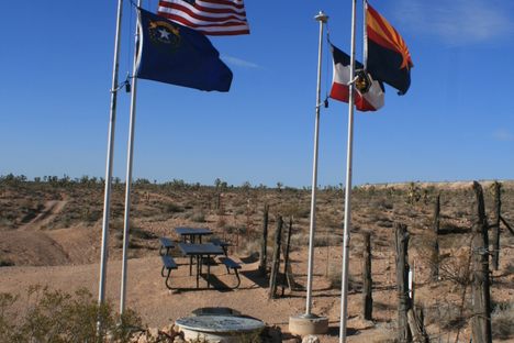 The monument site from the south, with the state flags and national flag.